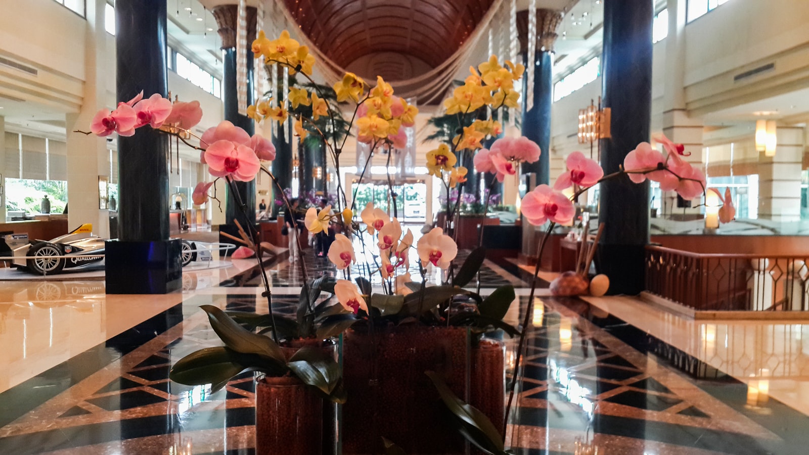 Elegant boutique hotel lobby with floral arrangements (hotel email marketing)