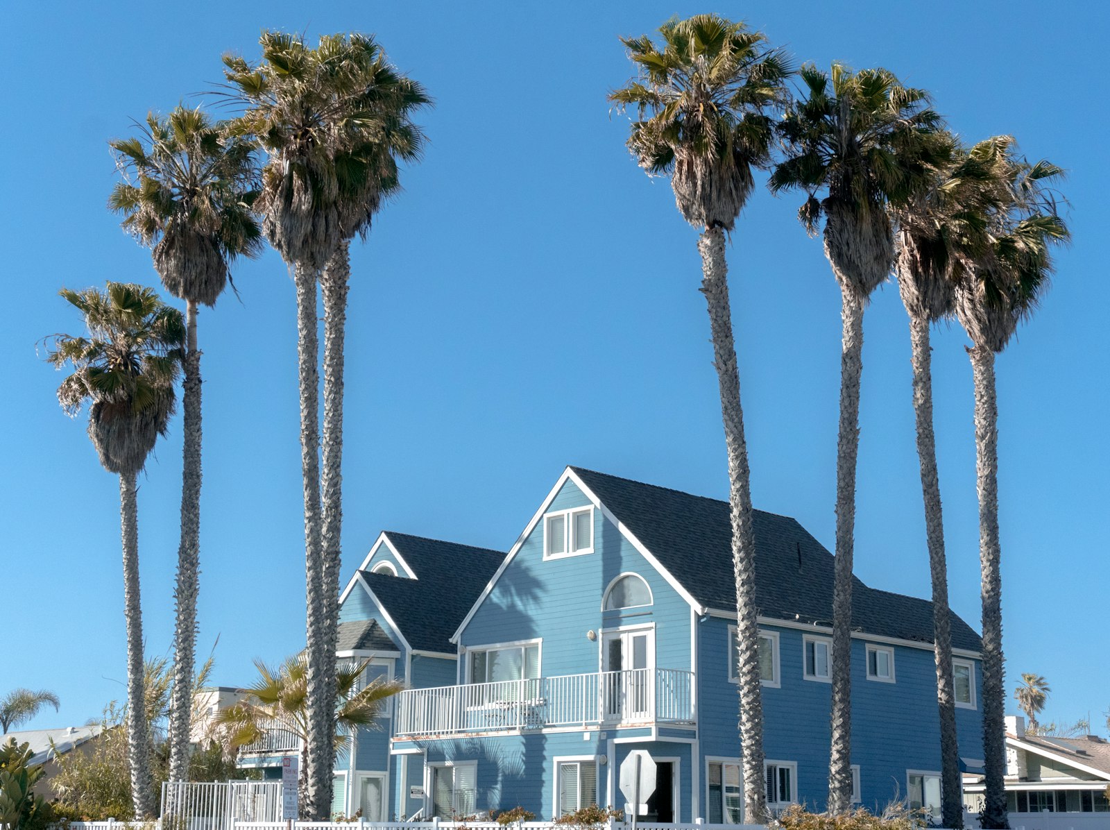 Blue and white vacation rental house, the kind managed with Lodgify vs Hostaway