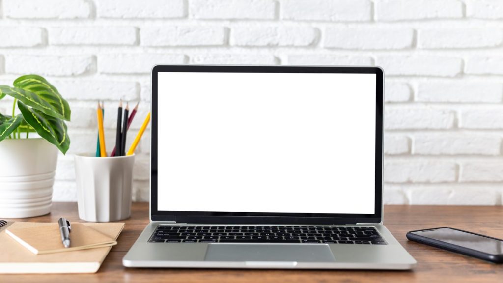 Laptop on a desk showing why is Expedia cheaper than booking direct