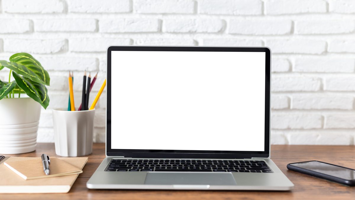 Laptop on a desk showing why is Expedia cheaper than booking direct