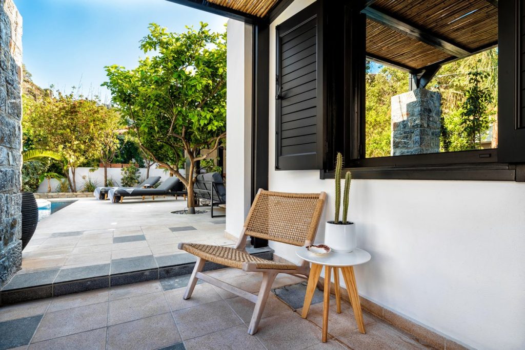 How to increase Airbnb occupancy rate: villa terrace with seating overlooking the pool