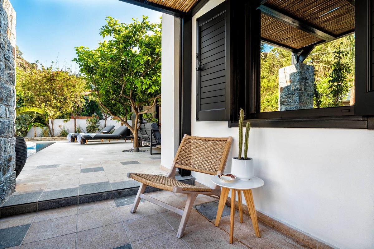 How to increase Airbnb occupancy rate: villa terrace with seating overlooking the pool