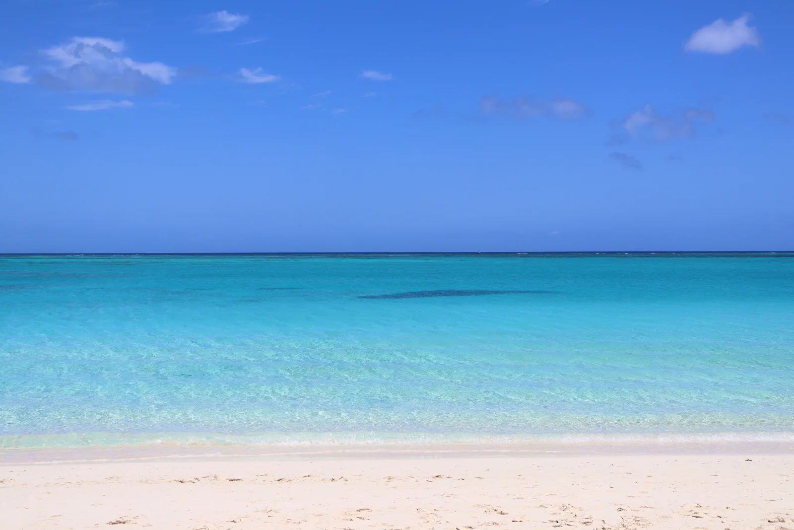 Grace Bay Beach in Providenciales, Turks and Caicos, clear shallow water over pale sand