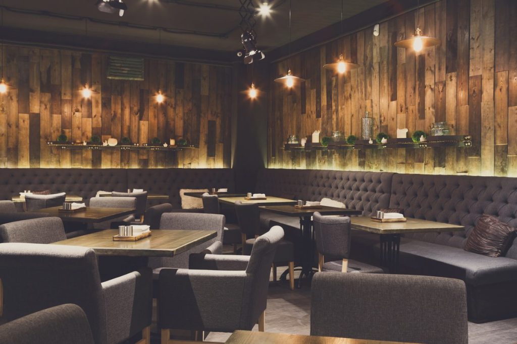 restaurant marketing strategies in action inside a warm wooden dining room
