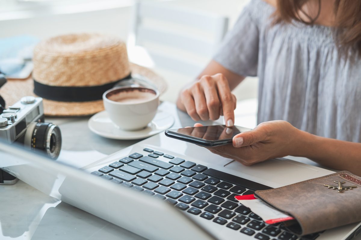 Why is my Airbnb not getting bookings: a traveler comparing rentals on a laptop and phone
